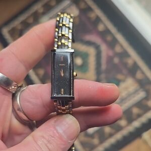 Seiko Silver Watch with Gold Crown and Black Bracelet